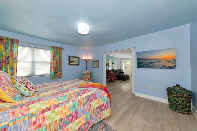 1722 Hazelwood St, Sarasota, FL 34231 - bedroom with light wood-style flooring and baseboards