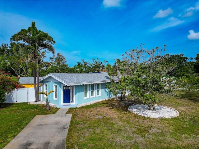 1722 Hazelwood St, Sarasota, FL 34231 - ranch-style home featuring stucco siding, roof with shingles, and a gate