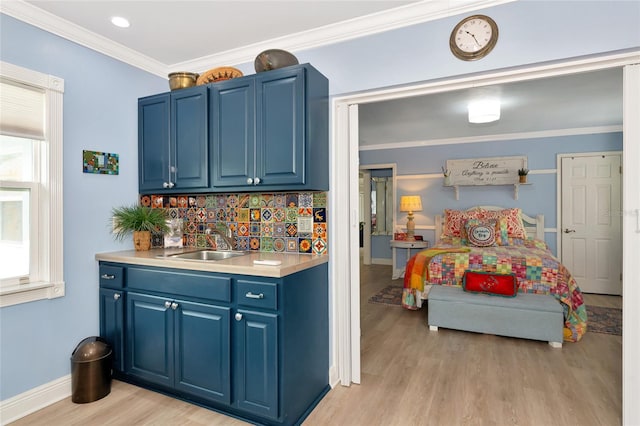 1722 Hazelwood St, Sarasota, FL 34231 - bar with a sink, light wood-type flooring, healthy amount of natural light, backsplash, and crown molding