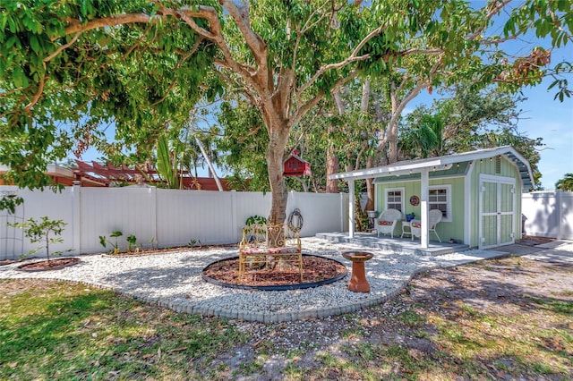 1722 Hazelwood St, Sarasota, FL 34231 - fenced backyard with an outbuilding and a patio