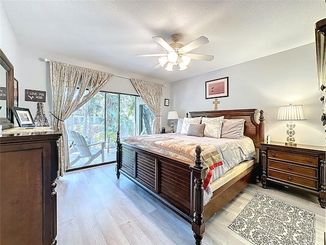 bedroom with a ceiling fan, a textured ceiling, light wood-style flooring, and access to exterior