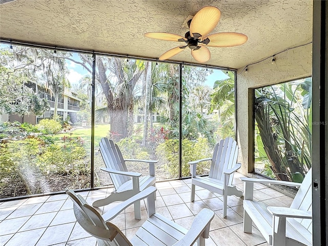 sunroom / solarium with a wealth of natural light, tile patterned floors, and expansive windows