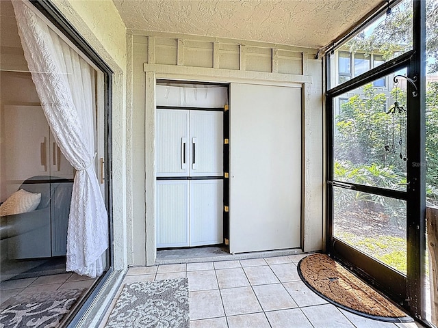 unfurnished sunroom featuring plenty of natural light