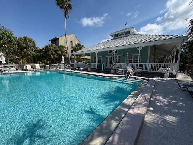 pool with a patio and french doors