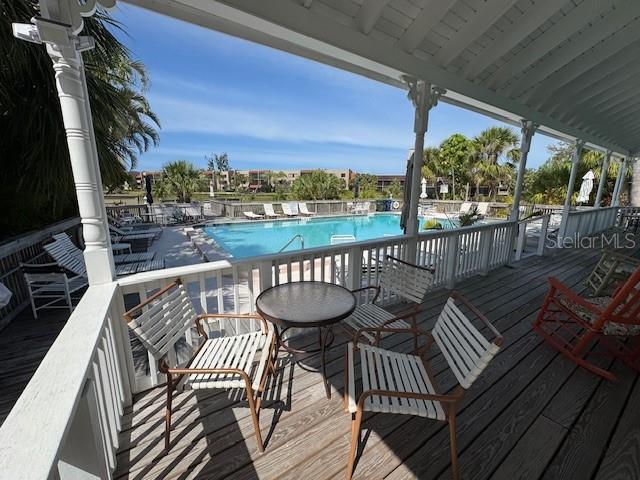 deck featuring a community pool