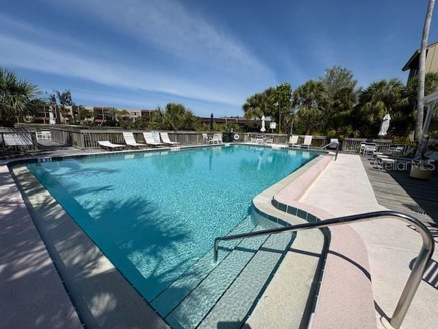 community pool with a patio