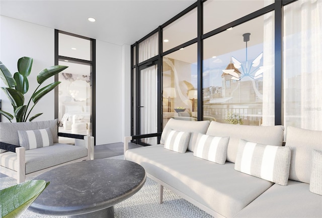 common area featuring recessed lighting and a wall of windows