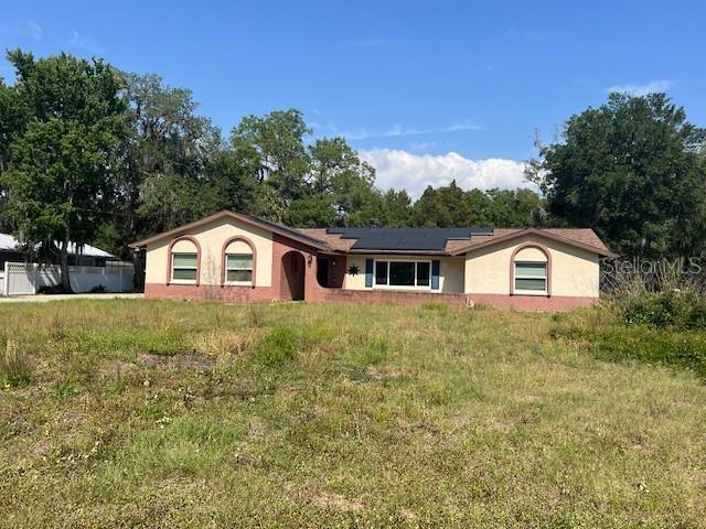 6383 N Jade Ter, Crystal River, FL 34428 - single story home with stucco siding and solar panels