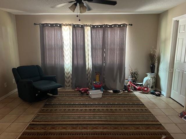6383 N Jade Ter, Crystal River, FL 34428 - sitting room featuring baseboards, a ceiling fan, and tile patterned floors