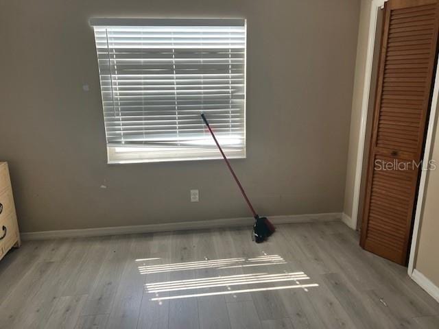 6383 N Jade Ter, Crystal River, FL 34428 - unfurnished bedroom with baseboards, light wood-style floors, and a closet