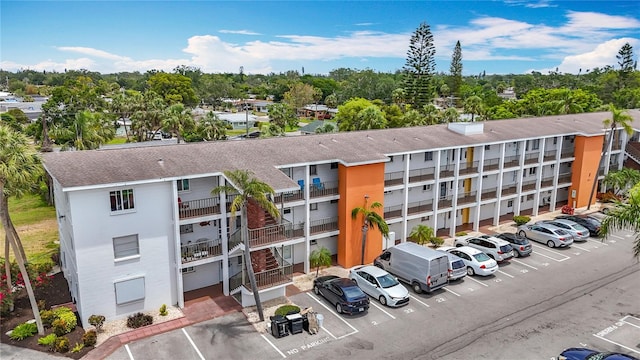 2321 Canal Dr Unit F25, Bradenton, FL 34207 - view of apartment building / complex featuring uncovered parking