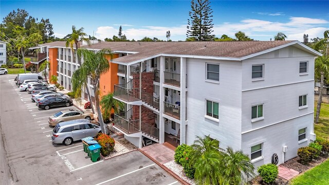2321 Canal Dr Unit F25, Bradenton, FL 34207 - view of apartment building / complex with uncovered parking