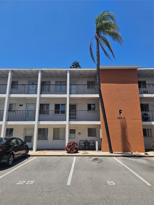2321 Canal Dr Unit F25, Bradenton, FL 34207 - view of apartment building / complex with uncovered parking