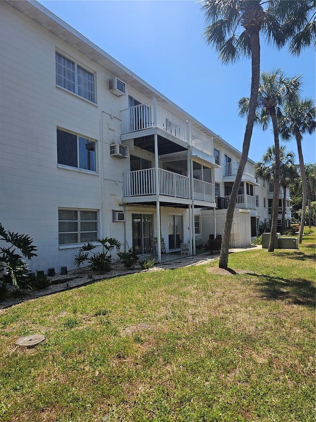 2321 Canal Dr Unit F25, Bradenton, FL 34207 - view of building exterior featuring a wall mounted air conditioner