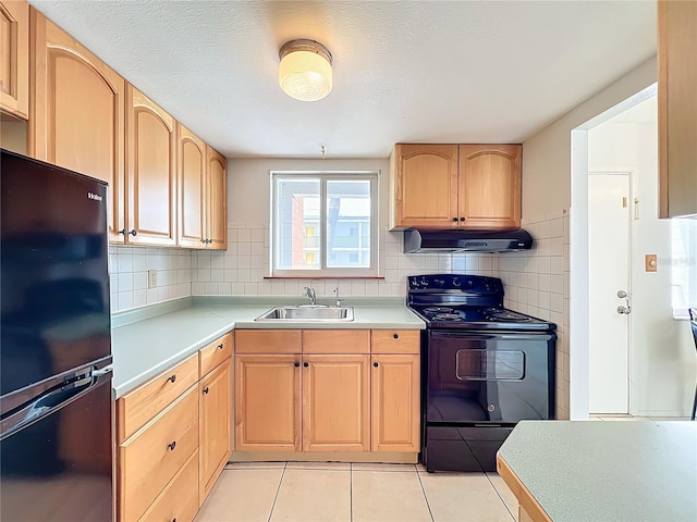 2321 Canal Dr Unit F25, Bradenton, FL 34207 - kitchen with black appliances, exhaust hood, a sink, and light countertops