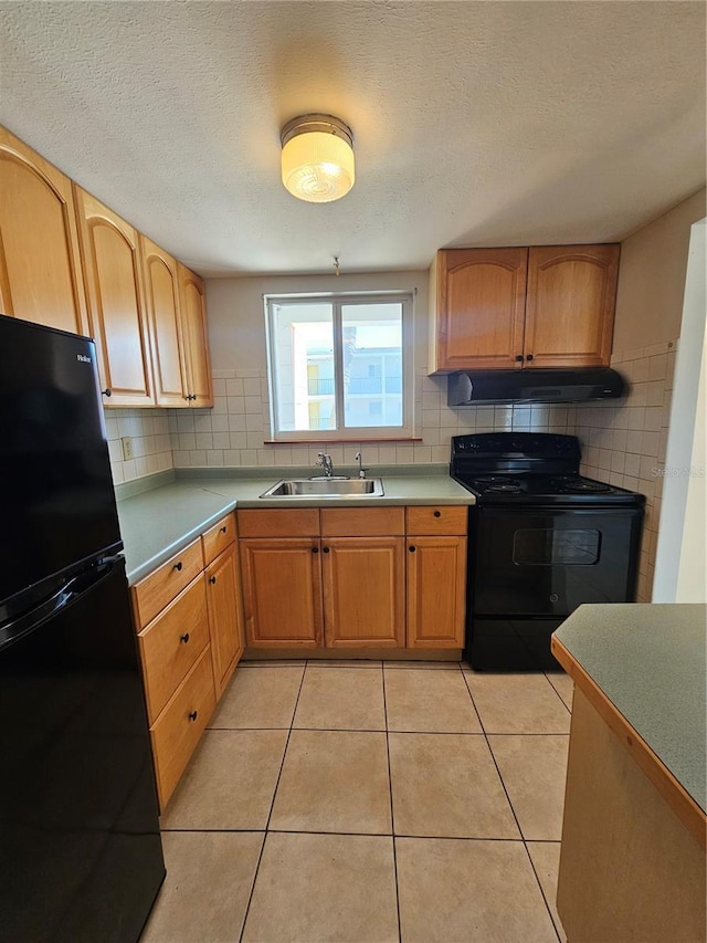 2321 Canal Dr Unit F25, Bradenton, FL 34207 - kitchen featuring black appliances, a sink, range hood, backsplash, and a textured ceiling