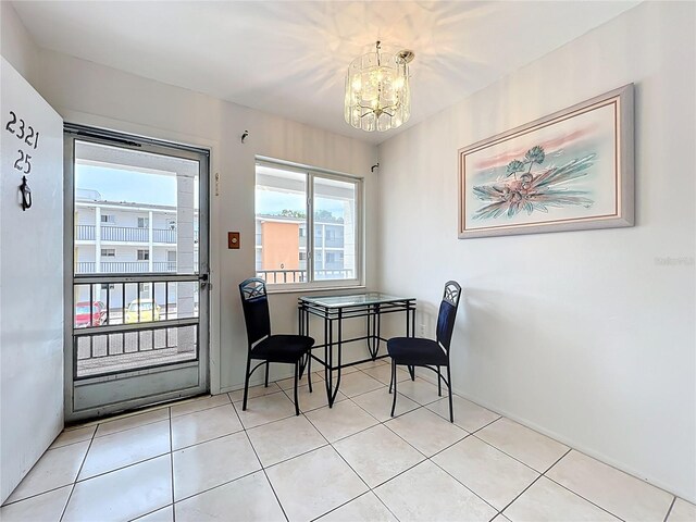 2321 Canal Dr Unit F25, Bradenton, FL 34207 - dining space with a chandelier, tile patterned flooring, and baseboards