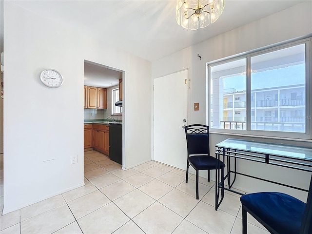 2321 Canal Dr Unit F25, Bradenton, FL 34207 - dining area featuring a chandelier and light tile patterned flooring