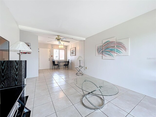 2321 Canal Dr Unit F25, Bradenton, FL 34207 - living area with light tile patterned flooring and ceiling fan