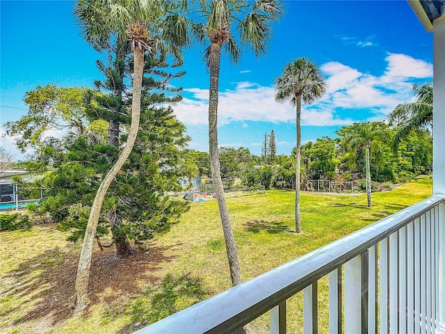 2321 Canal Dr Unit F25, Bradenton, FL 34207 - view of yard featuring a balcony and view of scattered trees