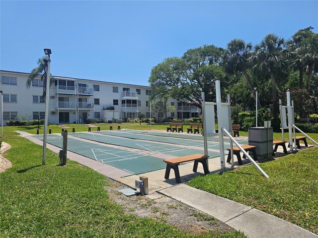 2321 Canal Dr Unit F25, Bradenton, FL 34207 - view of property's community featuring a lawn and shuffleboard