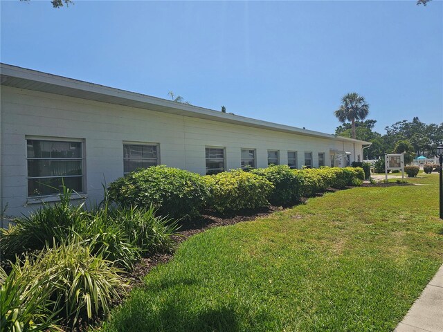 2321 Canal Dr Unit F25, Bradenton, FL 34207 - view of side of home with a lawn
