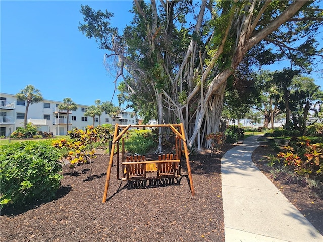 2321 Canal Dr Unit F25, Bradenton, FL 34207 - view of community with a playground and a residential view