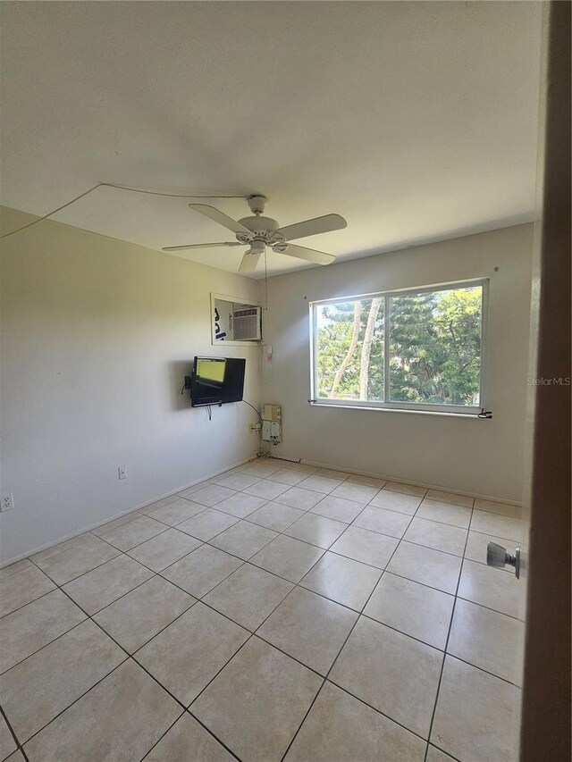 2321 Canal Dr Unit F25, Bradenton, FL 34207 - empty room featuring light tile patterned flooring and a ceiling fan