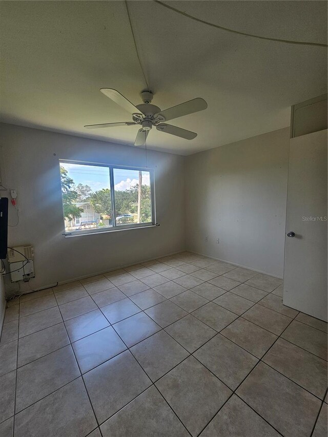 2321 Canal Dr Unit F25, Bradenton, FL 34207 - spare room featuring light tile patterned floors and a ceiling fan