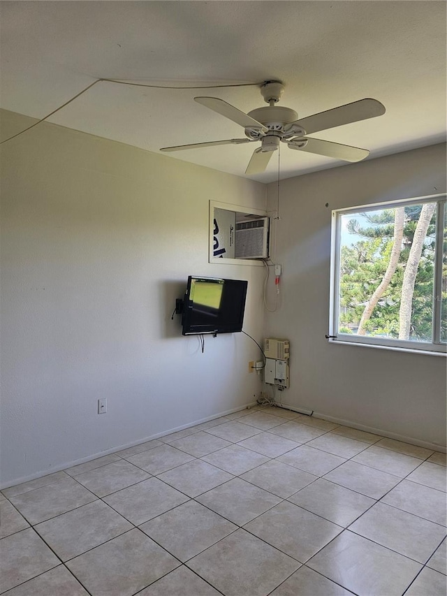 2321 Canal Dr Unit F25, Bradenton, FL 34207 - empty room featuring a wall mounted AC, light tile patterned floors, heating unit, a ceiling fan, and baseboards