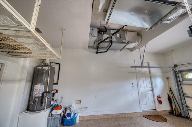 6919 Dominion Ln, Lakewood Ranch, FL 34202 - garage with water heater and baseboards