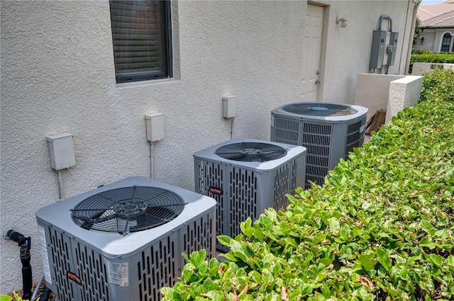 6919 Dominion Ln, Lakewood Ranch, FL 34202 - exterior view of a central air condition unit and stucco siding