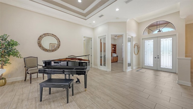 6919 Dominion Ln, Lakewood Ranch, FL 34202 - foyer with french doors, ornamental molding, a high ceiling, recessed lighting, and light wood-style flooring