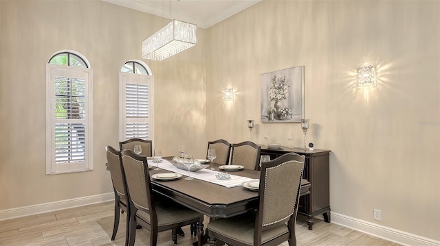 6919 Dominion Ln, Lakewood Ranch, FL 34202 - dining room featuring wood finished floors, a chandelier, and a high ceiling