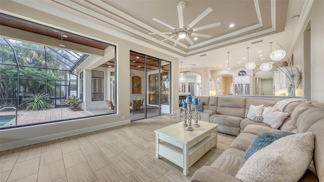 6919 Dominion Ln, Lakewood Ranch, FL 34202 - living room featuring ceiling fan, a raised ceiling, arched walkways, crown molding, and recessed lighting