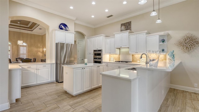 6919 Dominion Ln, Lakewood Ranch, FL 34202 - kitchen featuring stainless steel appliances, arched walkways, open shelves, a peninsula, and recessed lighting