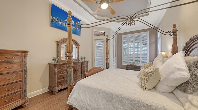 6919 Dominion Ln, Lakewood Ranch, FL 34202 - bedroom with light wood-style flooring, ornamental molding, and ceiling fan