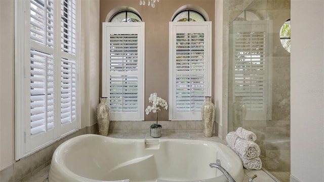 6919 Dominion Ln, Lakewood Ranch, FL 34202 - full bathroom featuring healthy amount of natural light, a bath, and tiled shower