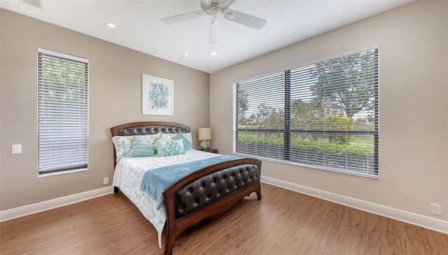 6919 Dominion Ln, Lakewood Ranch, FL 34202 - bedroom with wood finished floors, recessed lighting, and a ceiling fan
