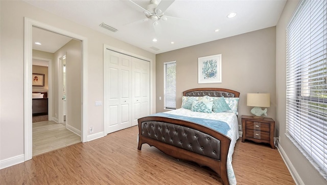 6919 Dominion Ln, Lakewood Ranch, FL 34202 - bedroom featuring light wood-style floors, a closet, recessed lighting, and ceiling fan