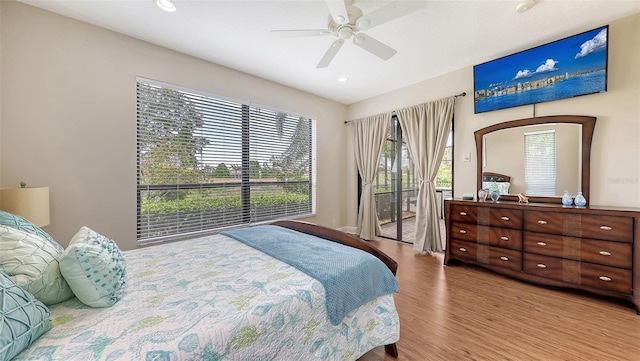 6919 Dominion Ln, Lakewood Ranch, FL 34202 - bedroom with wood finished floors, access to outside, a ceiling fan, and recessed lighting