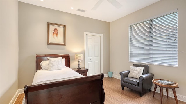 6919 Dominion Ln, Lakewood Ranch, FL 34202 - bedroom featuring light wood-style flooring and a ceiling fan