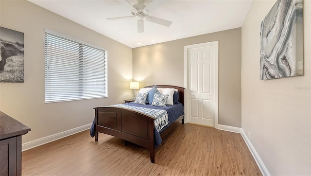 6919 Dominion Ln, Lakewood Ranch, FL 34202 - bedroom with light wood-style flooring and ceiling fan