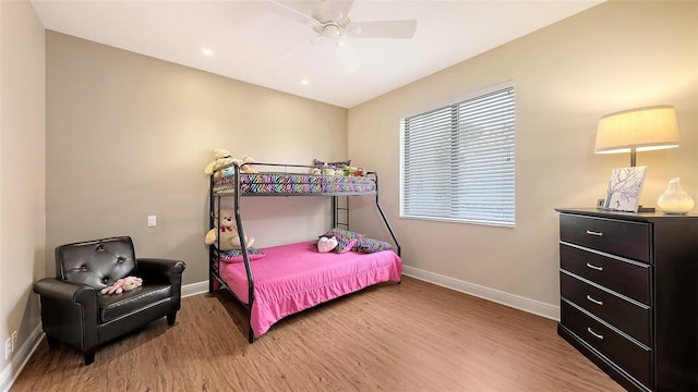 6919 Dominion Ln, Lakewood Ranch, FL 34202 - bedroom with light wood finished floors, a ceiling fan, and recessed lighting