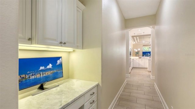 6919 Dominion Ln, Lakewood Ranch, FL 34202 - corridor featuring baseboards
