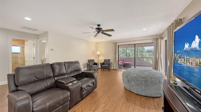 6919 Dominion Ln, Lakewood Ranch, FL 34202 - living area featuring wood finished floors, ceiling fan, and recessed lighting