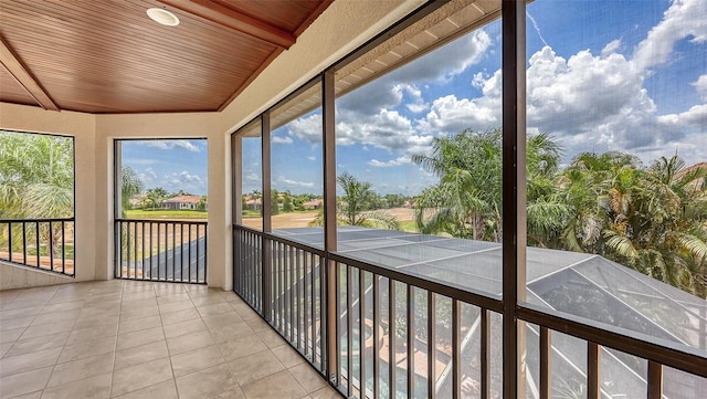 6919 Dominion Ln, Lakewood Ranch, FL 34202 - unfurnished sunroom with lofted ceiling