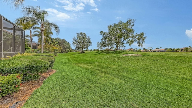 6919 Dominion Ln, Lakewood Ranch, FL 34202 - view of green lawn featuring glass enclosure