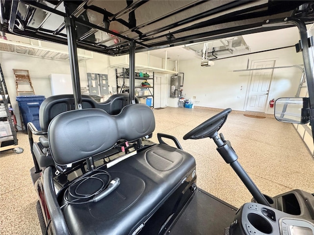6919 Dominion Ln, Lakewood Ranch, FL 34202 - workout area featuring a garage and water heater
