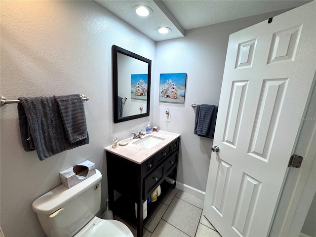 bathroom with vanity, toilet, baseboards, recessed lighting, and tile patterned floors